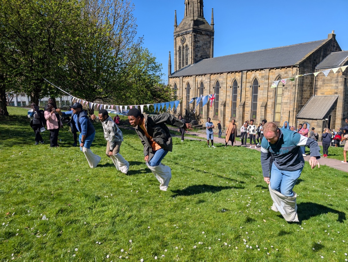 Families enjoying Easter activities near the church building.